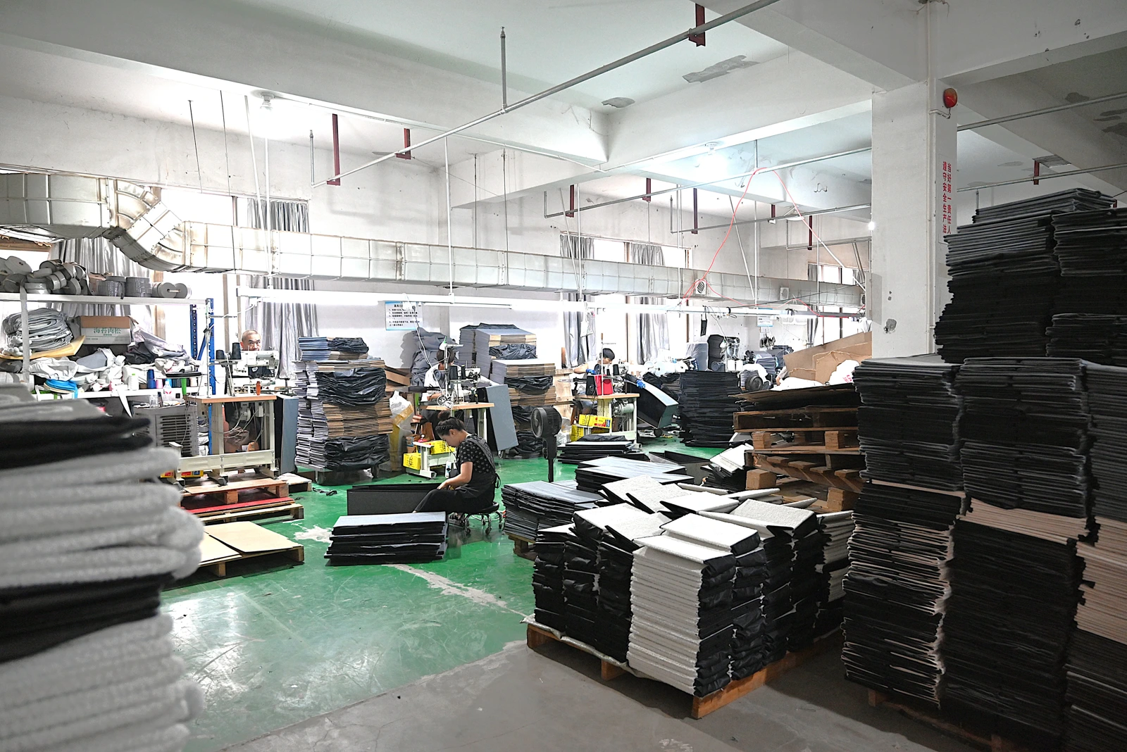 Pet product workshop production floor with workers and materials