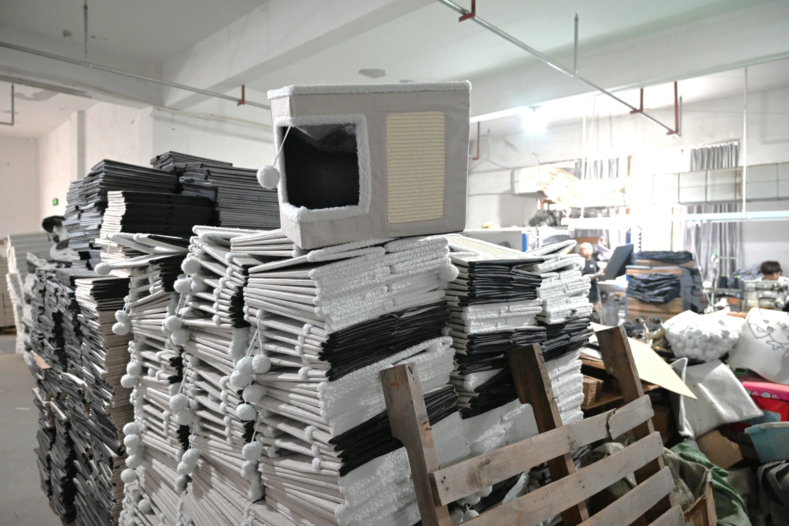 Factory workshop with stacked pet product materials