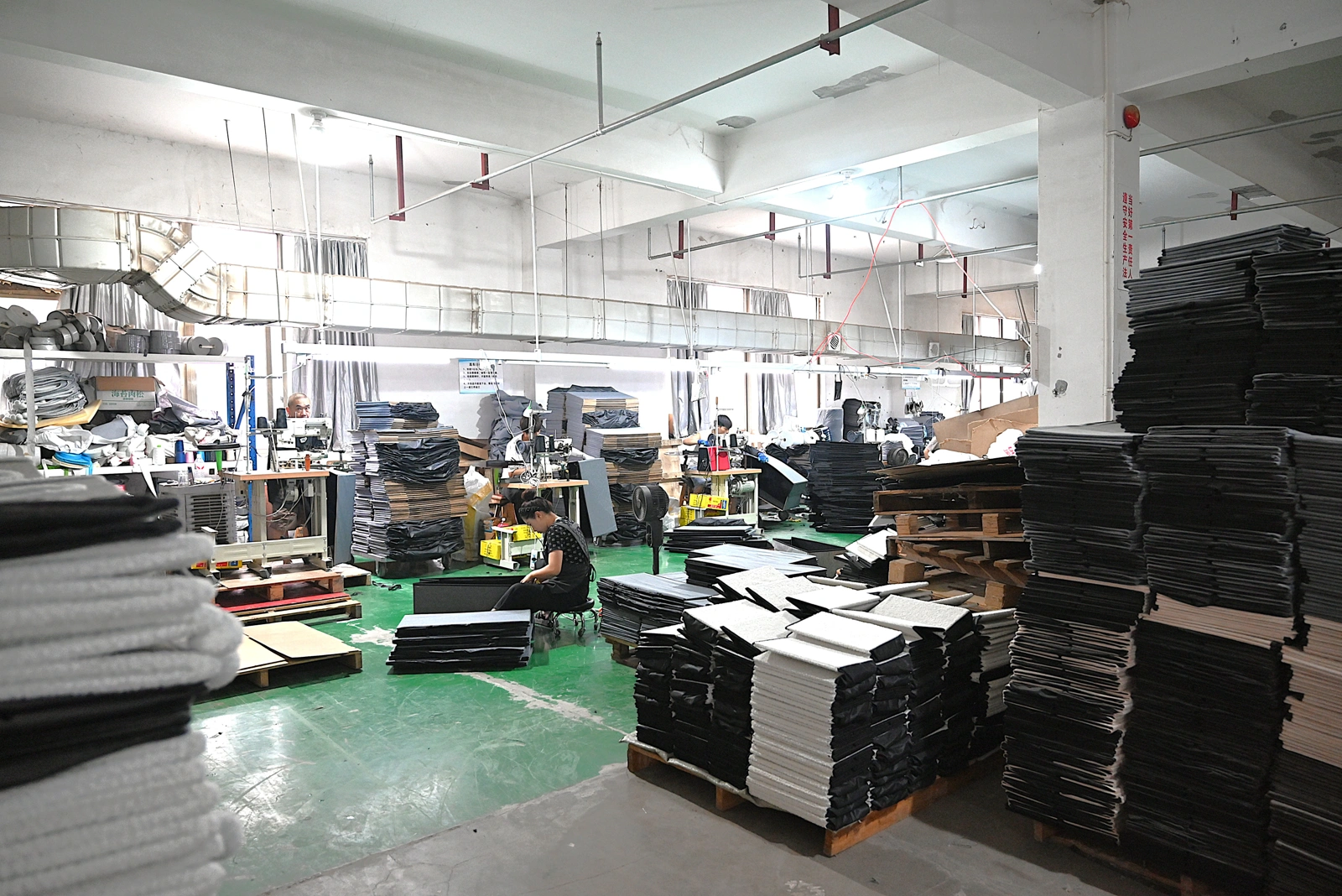 Pet product workshop production floor with workers and materials