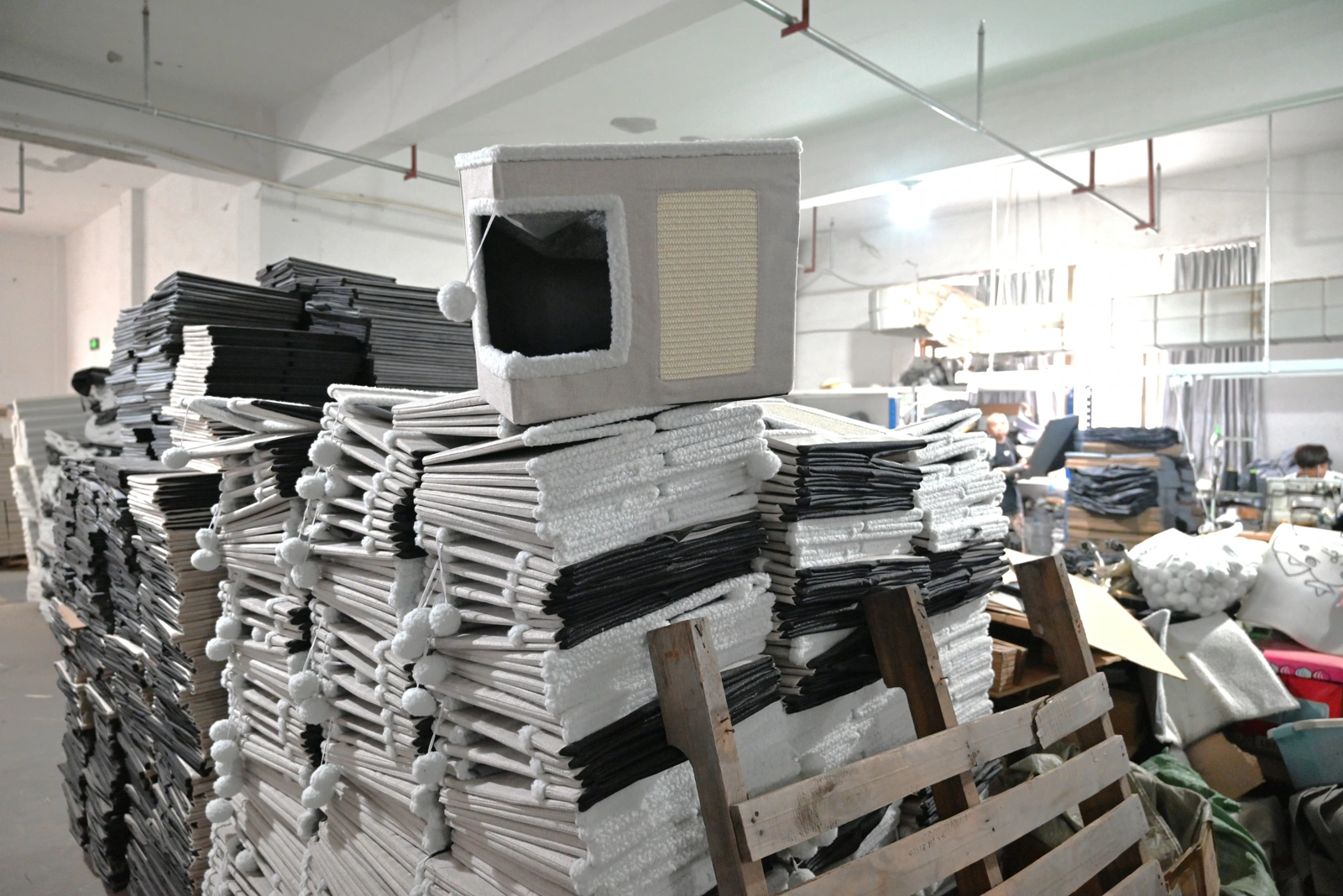 Factory workshop with stacked pet product materials